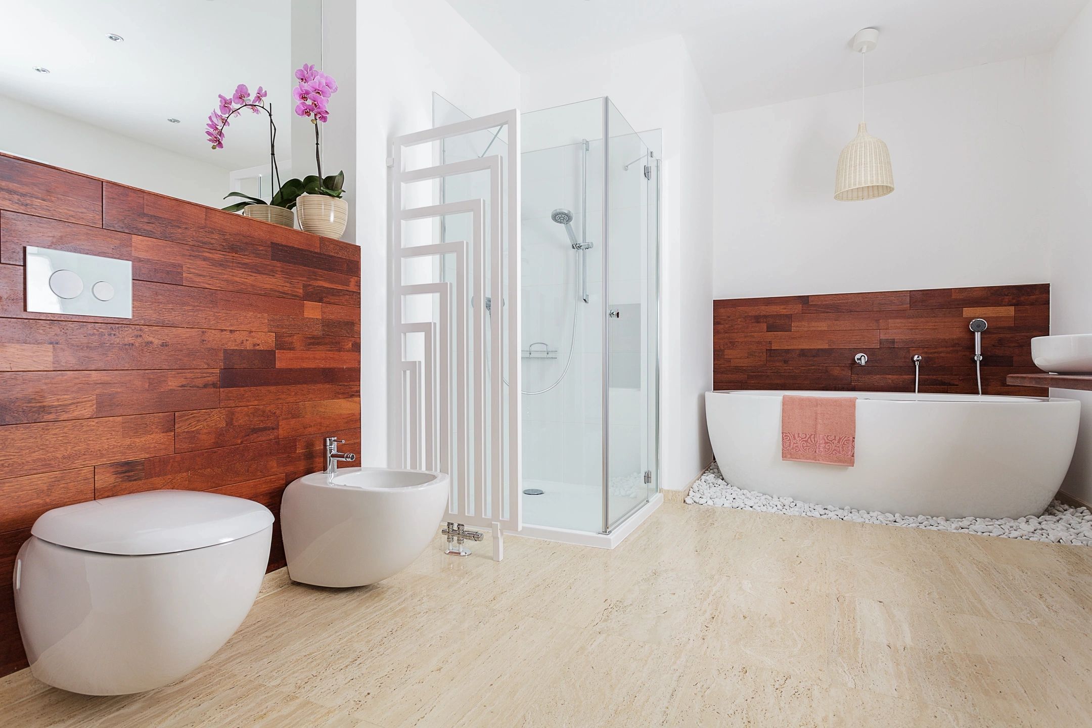 Shower enclosure with white subway tile and glass door