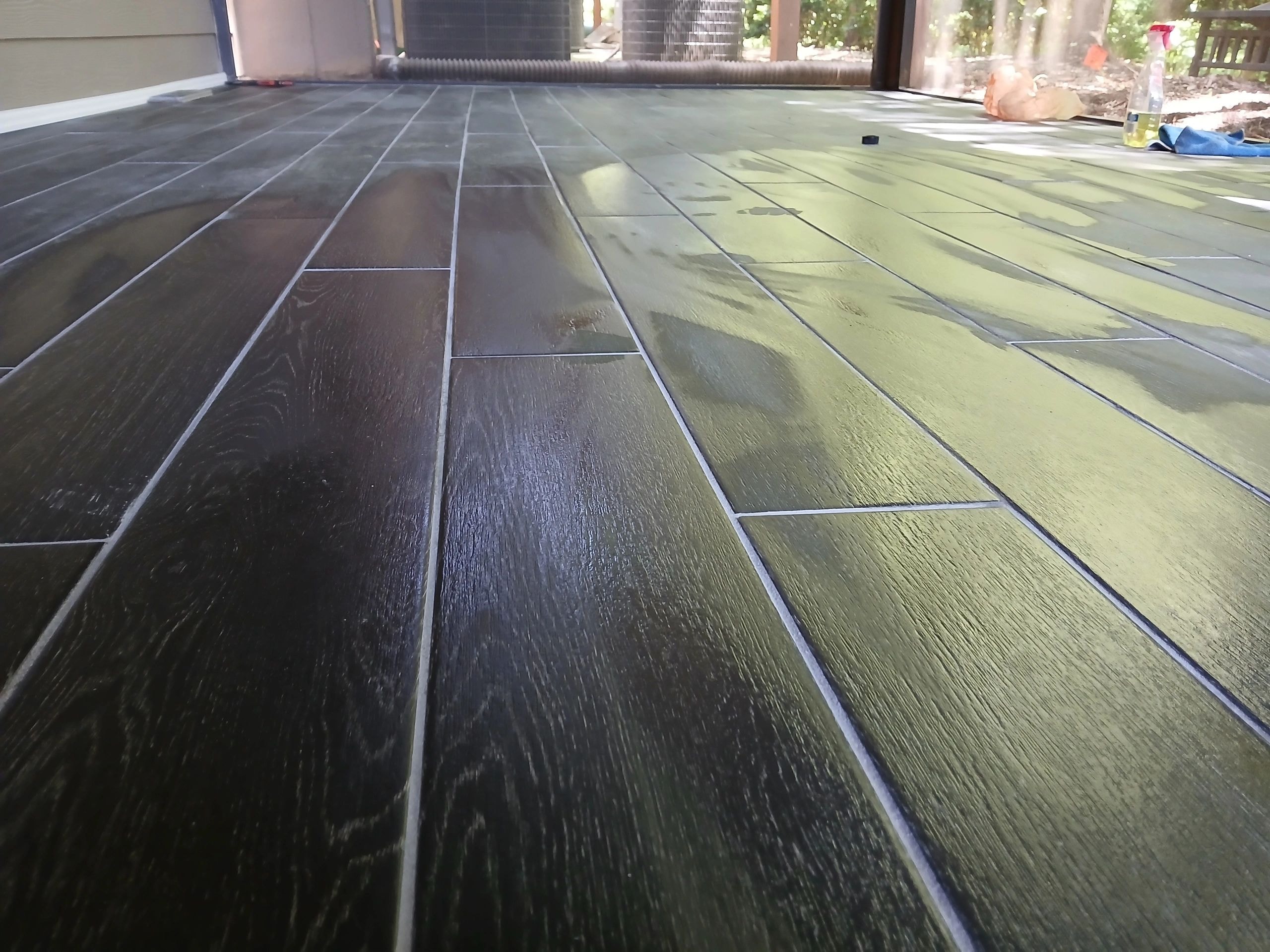 Wood plank flooring installation in progress