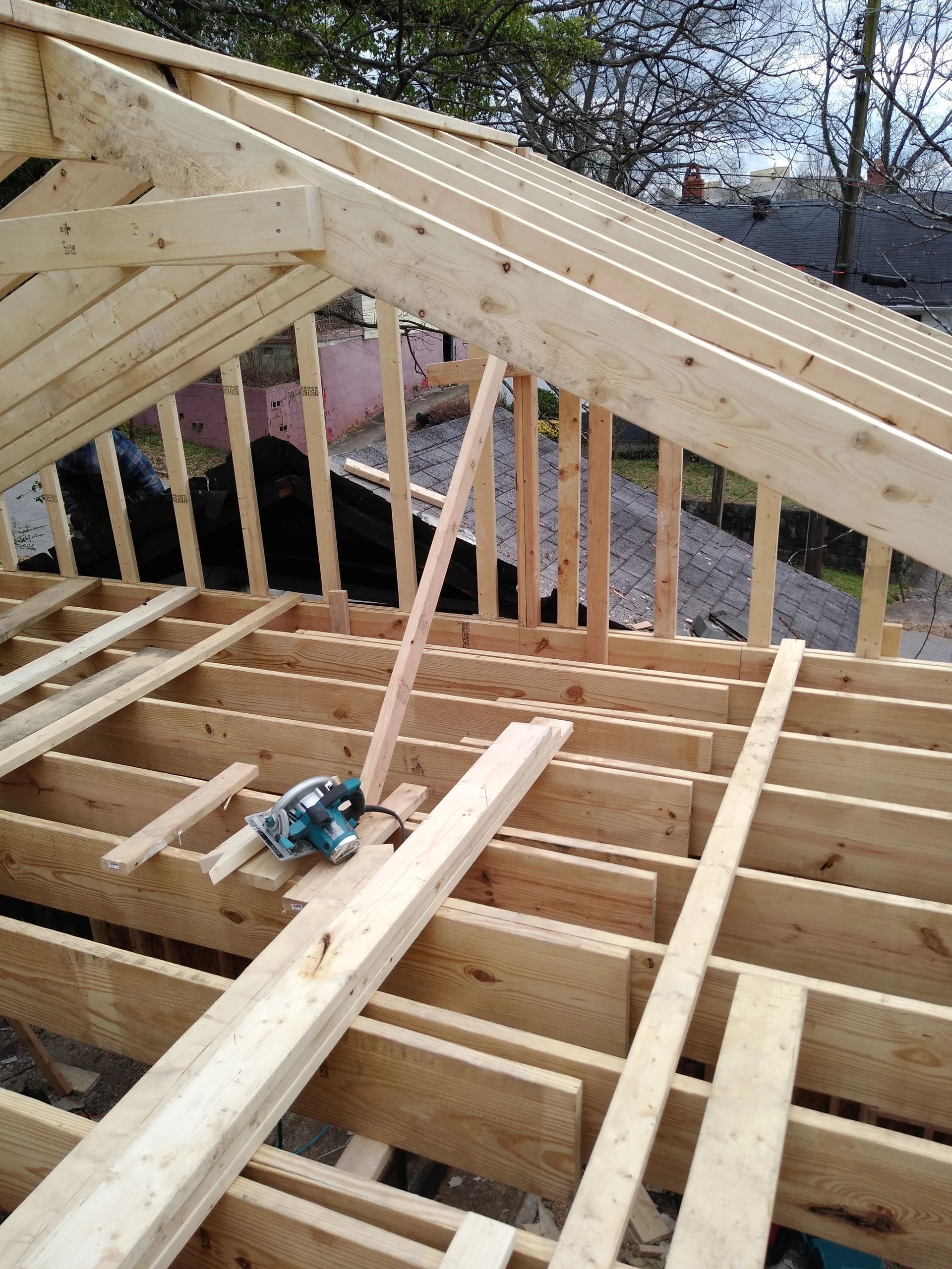 Wooden house frame construction in progress